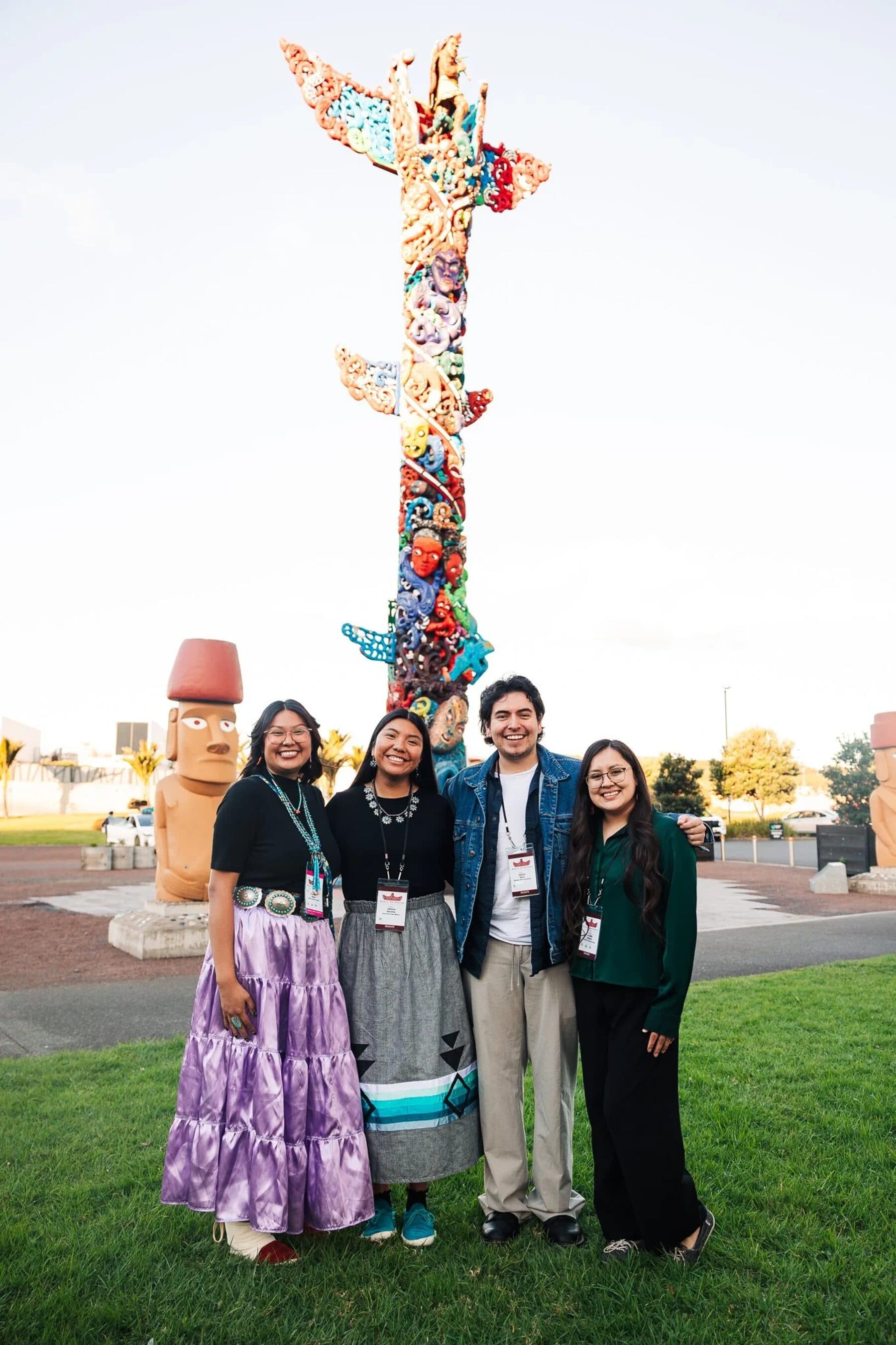 Rangatahi gathered at the pou at the World Indigenous Cancer Conference, Tāmaki Makaurau, April 2026